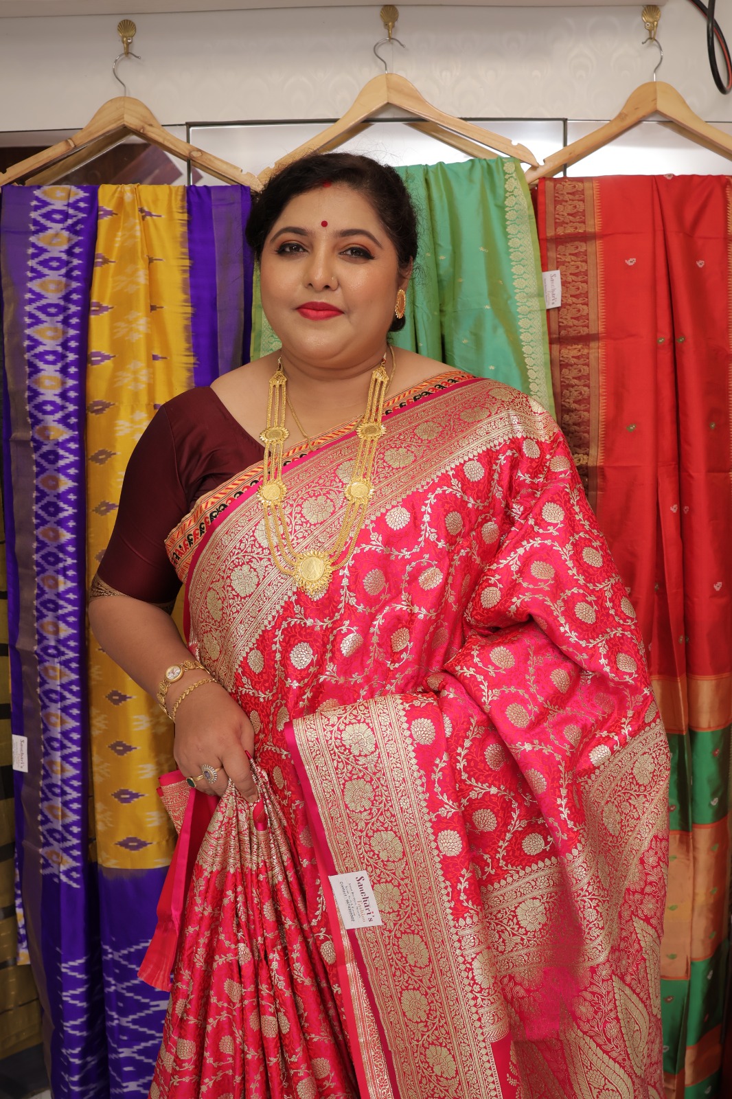 Pink Banarasi Saree with traditional golden zari floral motifs and intricate border