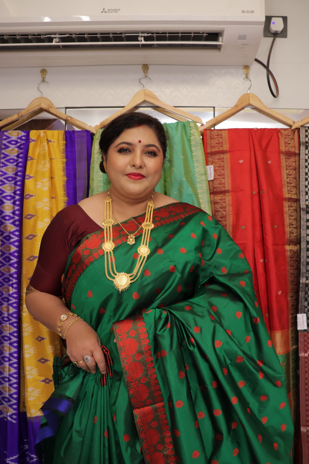 Pure Assam Silk Saree for women in green with red traditional motifs and decorative border
