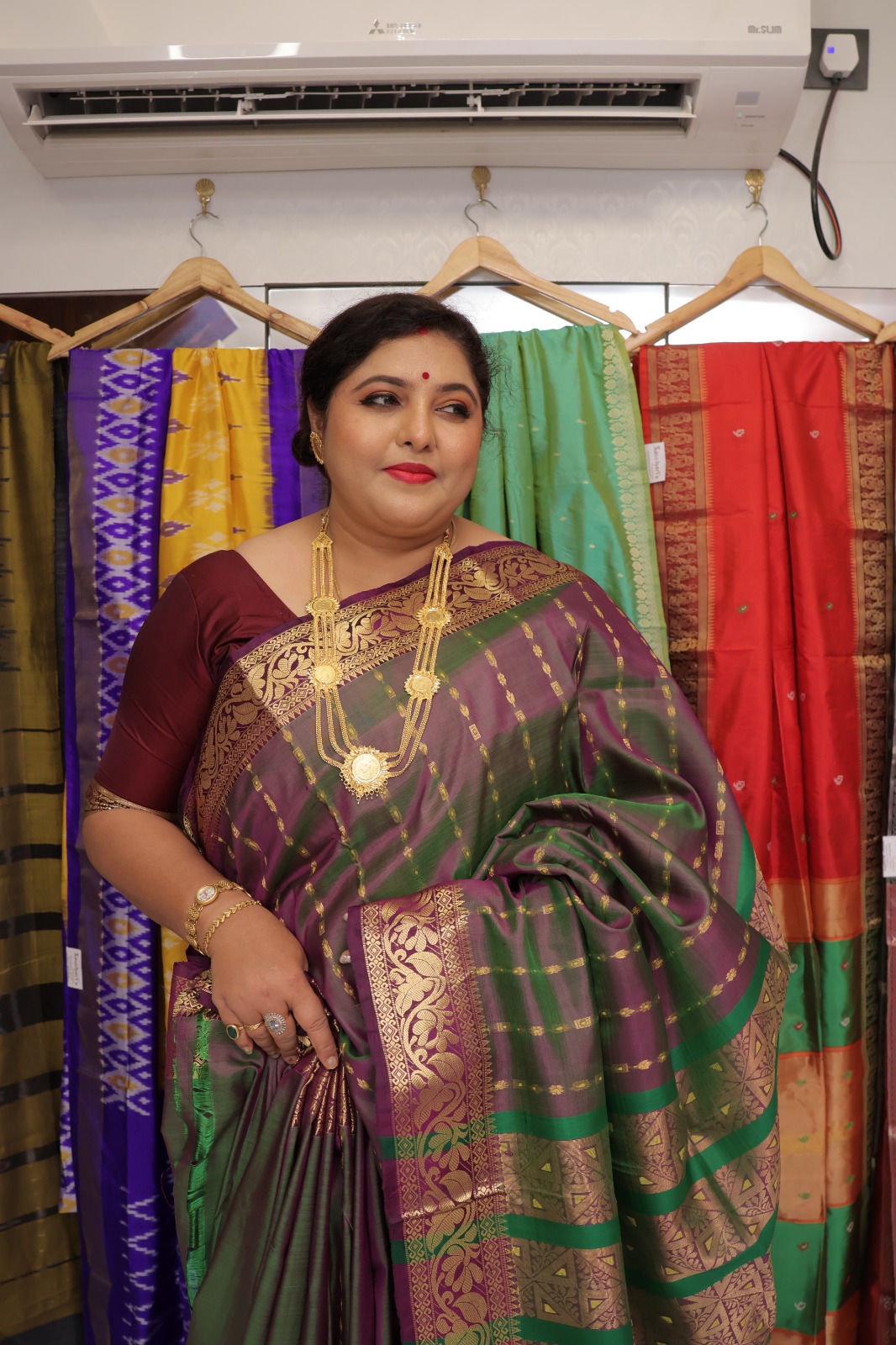 Boyvaban Pattu Silk Saree in purple and green with gold zari floral border